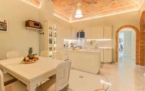 Charming Apartment Cartoni - Città Della Pieve, Um: Furniture, Table, Building, Chair, Lighting, Picture Frame, Interior Design, Floor, Flooring, Drawer