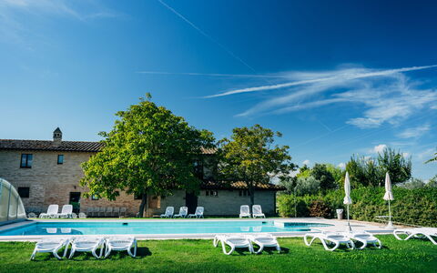 Villa Assisi: Sky, Cloud, Plant, Tree, Outdoor Furniture, Shade, Chair, Grass, Natural Landscape, Building