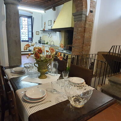 La Colonna: Table, Picture Frame, Furniture, Tableware, Chair, Building, Wood, Lighting, Dishware, Interior Design