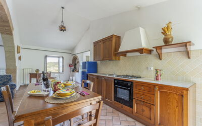 Apartment Podere: Cabinetry, Furniture, Countertop, Property, Drawer, Kitchen, Wood, Interior Design, Building, Flooring