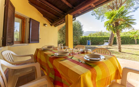 Argentario Giannella Apartment- Orbetello, Toscana: Table, Plant, Property, Furniture, Window, Chair, Building, Tablecloth, Tableware, Interior Design