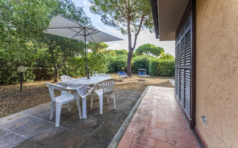 Giannella Apartment - Orbetello, Toscana: Plant, Property, Building, Furniture, Table, Nature, Shade, Tree, Outdoor Furniture, Architecture