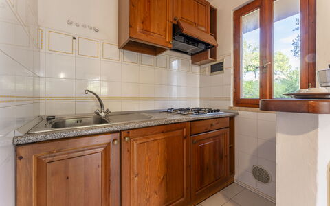 Giannella Apartment - Orbetello, Toscana: Brown, Cabinetry, Kitchen Sink, Countertop, Property, Furniture, Sink, Tap, Building, Kitchen