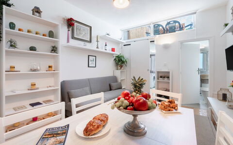 Lucca Old Town Apartment - Lucca, Toscana: Food, Property, Furniture, Table, Cabinetry, Orange, Couch, Interior Design, Countertop, Picture Frame