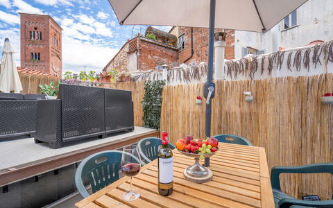 Lucca Old Town Apartment - Lucca, Toscana: Table, Furniture, Building, Property, Flowerpot, Cloud, Chair, Flower, Plant, Outdoor Furniture