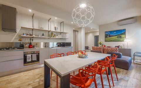 Lucy Florence Charming Modern Apartment Near Piazz: Table, Furniture, Property, Chair, Cabinetry, Wood, Countertop, Interior Design, Orange, Flooring