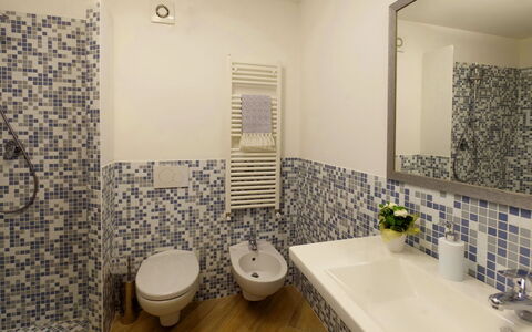 Villa Sant'andrea: Mirror, Plumbing Fixture, Tap, Sink, Bathroom, Plant, Purple, Lighting, Bathroom Sink, Interior Design