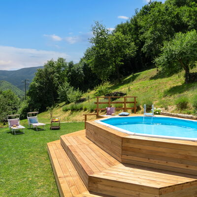 Villa Dei Tigli: Water, Plant, Sky, Swimming Pool, Tree, Cloud, Outdoor Furniture, Building, Natural Landscape, Shade