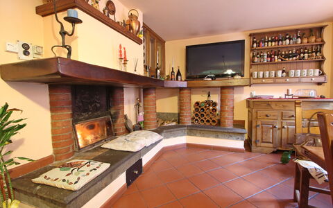 Villa La Rocca: Property, Furniture, Table, Wood, Picture Frame, Interior Design, Couch, Shelf, Living Room, Plant