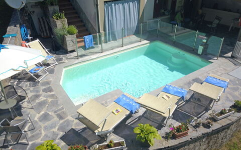 Villa La Rocca: Water, Plant, Property, Swimming Pool, Shade, Building, Leisure, Outdoor Furniture, Urban Design, Condominium