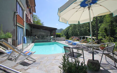 Villa La Rocca: Plant, Water, Property, Sky, Swimming Pool, Building, Umbrella, Shade, Outdoor Furniture, Sunlounger