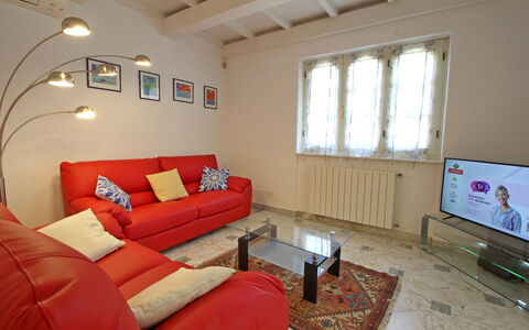 Villa Le Macchie: Couch, Furniture, Property, Window, Table, Picture Frame, Interior Design, Living Room, Wood, Floor