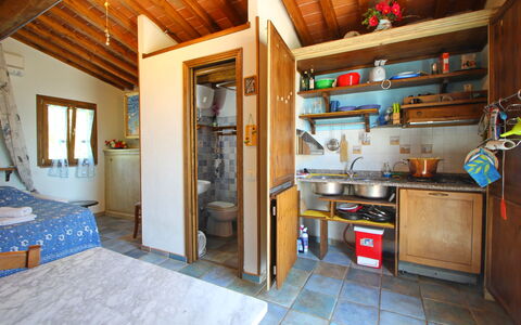 La Casetta: Property, Furniture, Building, Blue, Cabinetry, Wood, Interior Design, Countertop, Floor, Kitchen Appliance