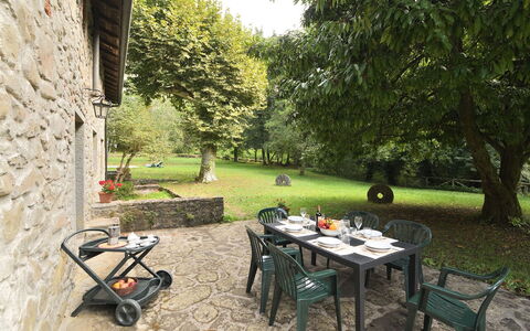 Villa Del Mulino: Plant, Table, Tree, Outdoor Furniture, Outdoor Table, Chair, Shade, Grass, Flowerpot, Wood