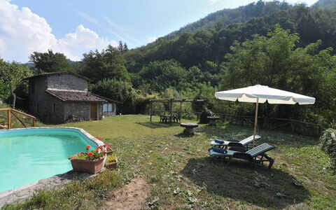 Casa Antelminelli: Plant, Water, Sky, Cloud, Tree, Outdoor Furniture, Shade, Mountain, Building, Natural Landscape