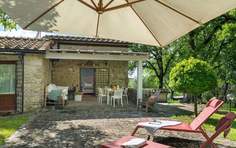 Villa Ida: Plant, Property, Furniture, Building, Window, Shade, Table, Umbrella, Outdoor Furniture, Chair