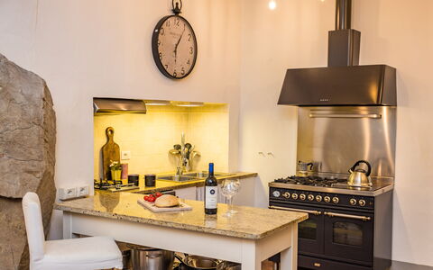 Rose's Palace: Property, Cabinetry, Countertop, Wood, Kitchen Appliance, Kitchen, Lighting, Kitchen Stove, Interior Design, Home Appliance