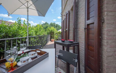 Torri 15 Holiday Home: Sky, Building, Property, Table, Furniture, Cloud, Tableware, Window, Architecture, Flowerpot