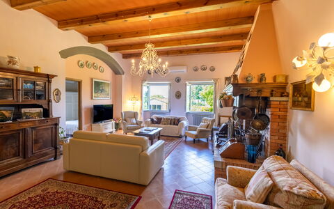 Montelucci Chianti Agrivilla: Picture Frame, Couch, Lighting, Interior Design, Yellow, Floor, Living Room, Wood, Lamp, Decoration