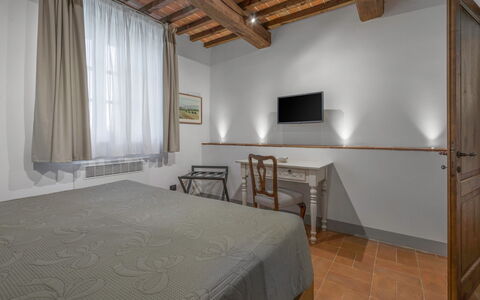 Le Torri, Borgo Campassini, Monteriggioni: Interior Design, Ceiling, Room, Bed Frame, Bedroom, Hardwood, Wood Stain, Picture Frame, Lamp, Light Fixture