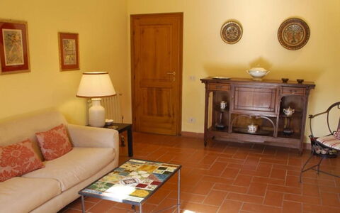 Podere Torre: Furniture, Flooring, Interior Design, Floor, Wood, Room, Picture Frame, Living Room, Lighting, Brown