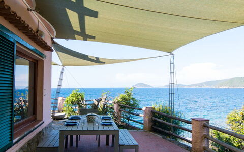 Villa Marciana: Body Of Water, Coastal And Oceanic Landforms, Sea, Furniture, Coast, Shade, Ocean, Outdoor Furniture, Lake, Chair