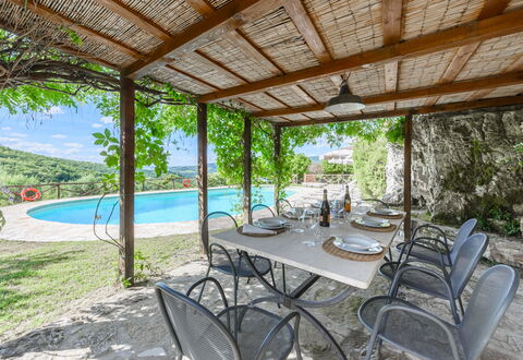 Villa Poggio La Croce: Furniture, Outdoor Furniture, Chair, Swimming Pool, Outdoor Table, Resort, Flagstone, Eco Hotel, Shade, Kitchen & Dining Room Table