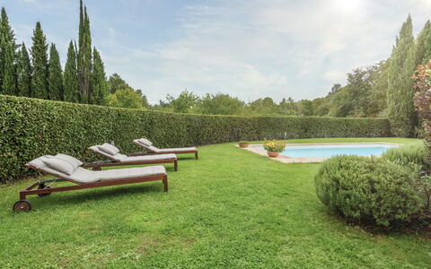 Villa Zambra: Swimming Pool, Garden, Shrub, Outdoor Furniture, Shade, Lawn, Resort, Landscaping, Hedge, Yard