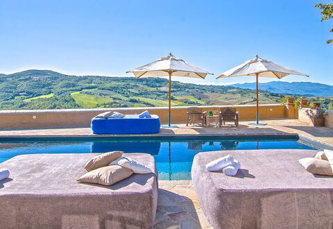 Villa Sagrantino: Blue, Swimming Pool, Resort, Outdoor Furniture, Umbrella, Mountain Range, Sunlounger, Hotel, Villa, Eco Hotel