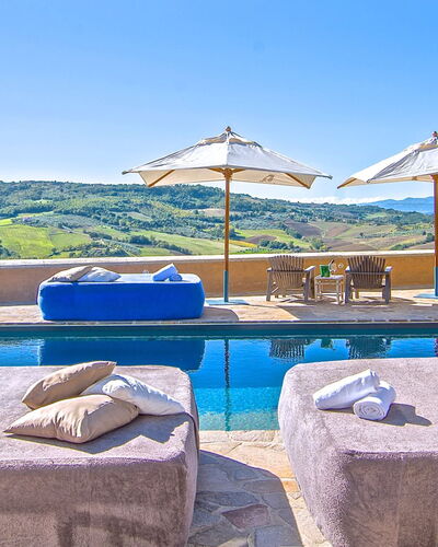 Villa Sagrantino: Blue, Swimming Pool, Resort, Outdoor Furniture, Umbrella, Mountain Range, Sunlounger, Hotel, Villa, Eco Hotel