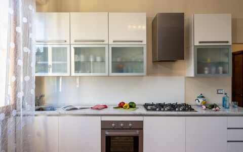 Casamia Tuscan Oasis: 4Br Panoramic Penthouse, Sky: Kitchen, Kitchen Appliance, Major Appliance, Countertop, Cabinetry, Interior Design, Wood, Furniture, Home Appliance, Flooring