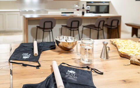 Villa Cortona: Eco-Sustainable Luxury Estate with: Furniture, Wood Stain, Hardwood, Home Appliance, Cooking, Serveware, Wood Flooring, Food, Countertop