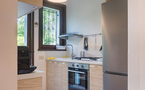 Casa Carla: Kitchen Appliance, Kitchen, Major Appliance, Countertop, Interior Design, Wood, Flooring, Cabinetry, Home Appliance, Furniture