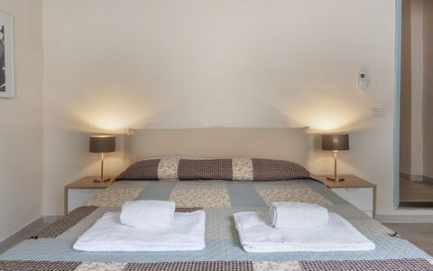 San Cristofano Blu Apartment Santa Croce, Florence: Furniture, Bed, Interior Design, Bedroom, Floor, Flooring, Wood, Bedding, Room, Ceiling