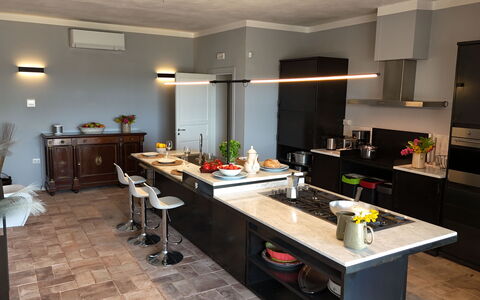 Villa Sassinoro: Furniture, Kitchen, Countertop, Interior Design, Flooring, Cabinetry, Wood, Kitchen Appliance, Light Fixture, Lighting