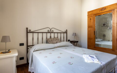 Casa Olivia With Garden And Wifi: Bed, Furniture, Bedroom, Interior Design, Wall, Bed Sheet, Bedding, Floor, Wood, Flooring