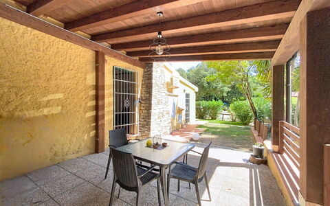 Your Tuscan Retreat: Wood, Furniture, Flooring, Porch, Outdoor Furniture, Floor, Door, Home, Shade, Resort
