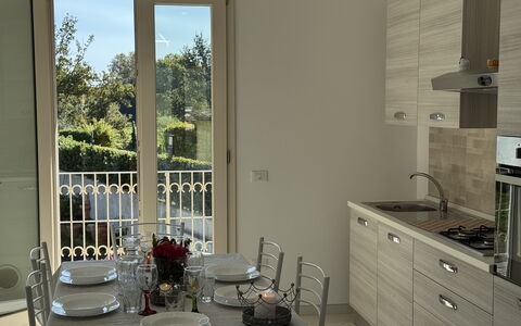 Villa al Glicine Proprietà: Furniture, Interior Design, Flooring, Wood, Kitchen, Floor, Countertop, Room, Major Appliance, Lighting