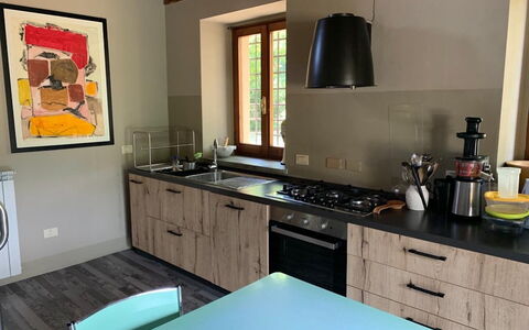 Villa Vindelbono: Kitchen, Countertop, Furniture, Kitchen Appliance, Wood, Flooring, Interior Design, Cabinetry, Major Appliance, Home Appliance