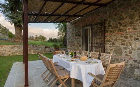 La Morella: Furniture, Outdoor Furniture, Chair, Kitchen & Dining Room Table, Flagstone, Stone Wall, Outdoor Table, Backyard, Garden, Shade