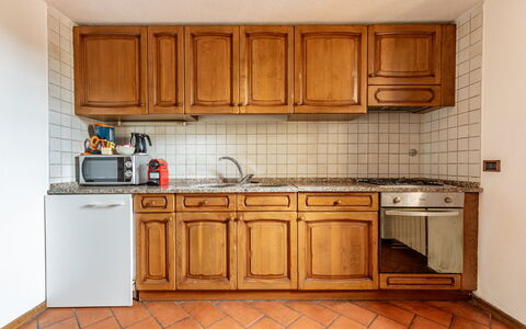 Relais de Ricci: Kitchen, Wood, Countertop, Kitchen Appliance, Flooring, Major Appliance, Cabinetry, Interior Design, Floor, Room