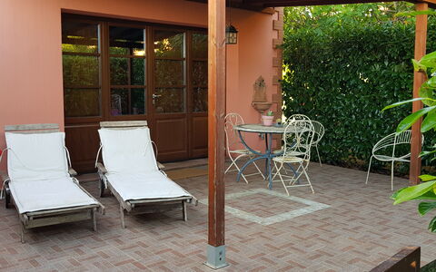 Suite Orchidea Seaside and Pool: Furniture, Outdoor Furniture, Shade, Chair, Wood Stain, Garden, Flowerpot, Backyard, Outdoor Structure, Outdoor Table