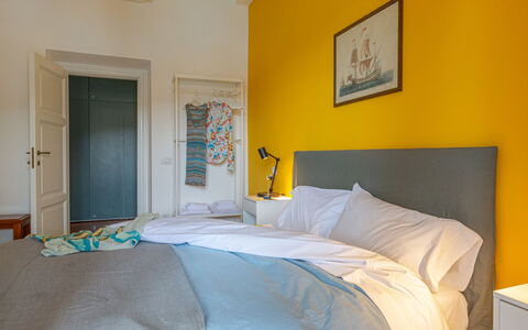 Villa Fior di Roccia: Furniture, Bed, Bedroom, Interior Design, Bedding, Bed Sheet, Yellow, Linens, Floor, Flooring