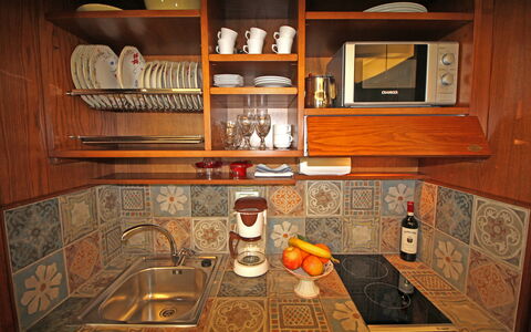 La Casa sulla Piazza: Wood, Kitchen, Interior Design, Flooring, Brown, Cabinetry, Wood Stain, Floor, Kitchen Appliance, Room