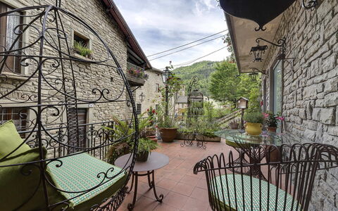 Villa Senio: Flowerpot, Iron, Houseplant, Chair, Outdoor Furniture, Light Fixture, Balcony, Outdoor Table, Flagstone, Courtyard