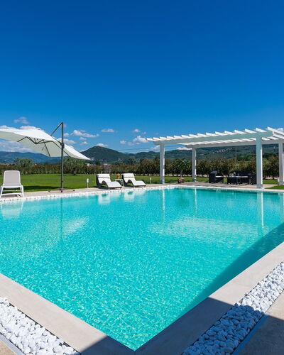 Villa Monsummano: Blue, Swimming Pool, Water, Resort, Composite Material, Eco Hotel, Leisure, Outdoor Furniture, Shade, Landscaping