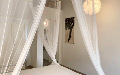 Villa Ombrone: Mosquito Net, Interior Design, Wood, Bedroom, Textile, Lighting, Canopy Bed, Floor, Furniture, Bed