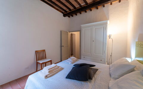 Le Loggine del Pignatello Apartment, Siena City: Bed, Bedroom, Wall, Floor, Flooring, Interior Design, Wood, Bed Sheet, Ceiling, Furniture