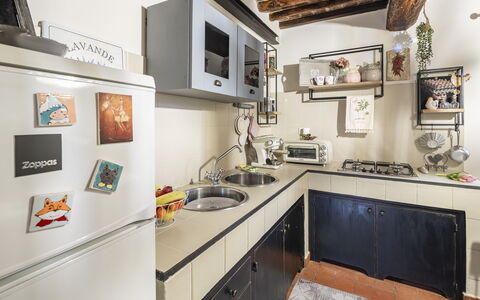 La Casa del Grillo Parlante: Kitchen, Kitchen Appliance, Countertop, Major Appliance, Interior Design, Furniture, Kitchen Stove, Cabinetry, Home Appliance, Flooring