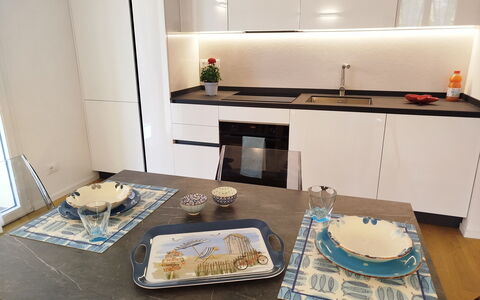 Lola Home - Levanto: Wood, Flooring, Interior Design, Furniture, Kitchen, Countertop, Floor, Kitchen Appliance, Home, Cabinetry